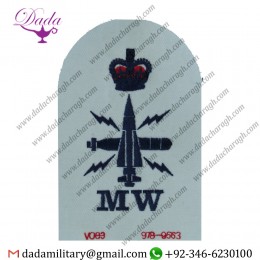 OPERATOR MECHANIC  + CROWN MW TRADE BLUE ON WHITE QUEEN'S CROWN. EMBROIDERED NAVAL BRANCH, RANK OR MISCELLANEOUS