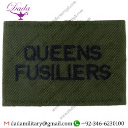 QUEENS  FUSILIERS BLACK ON OLIVE GREEN EMBROIDERED SLIP-ON ARMY CLOTH SHOULDER TITLE