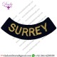 SURREY CURVED CHEST TITLE- SMALL YELLOW ON DARK BLUE EMBROIDERED