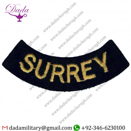 SURREY CURVED CHEST TITLE- SMALL YELLOW ON DARK BLUE EMBROIDERED