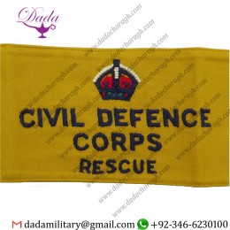 CIVIL DEFENCE CORPS RESCUE ARMBAND (REGIONAL STAFF) NAVY BLUE ON YELLOW WITH KING'S CROWN. EMBROIDERED ARM-BAND OR BRASSARD